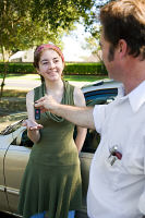 Woman being given keys to car. Hypnosis can help you pass your driving test.