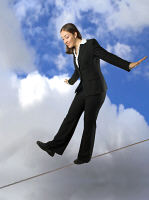 Picture of a woman on a tightrope - in control